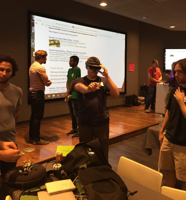 A KCVR Hackathon participant tests the Hololens during team networking.
