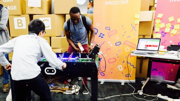 Students play a DIY, internet connected, digital foosball table at the Mozilla Festival