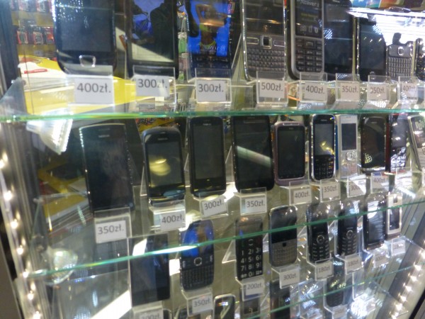 Selection of mobile phones in a small shop in Warsaw, Poland.