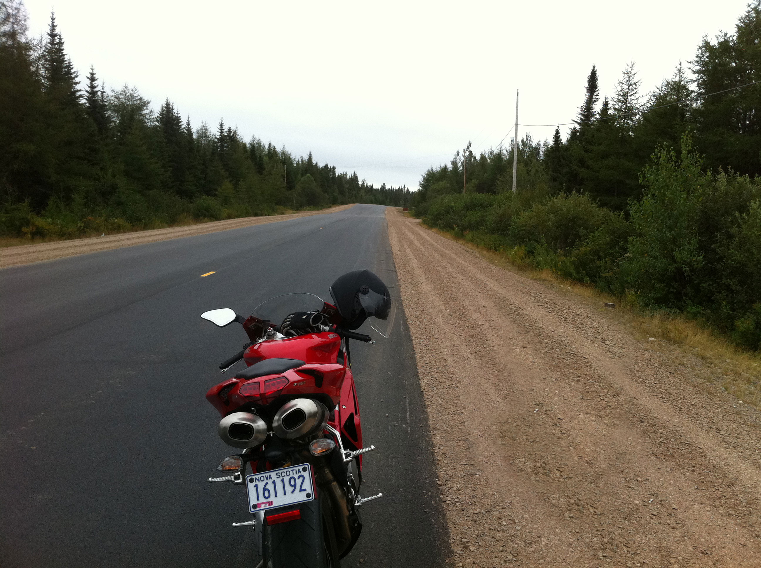 Ducati motorcycle on a long, open road