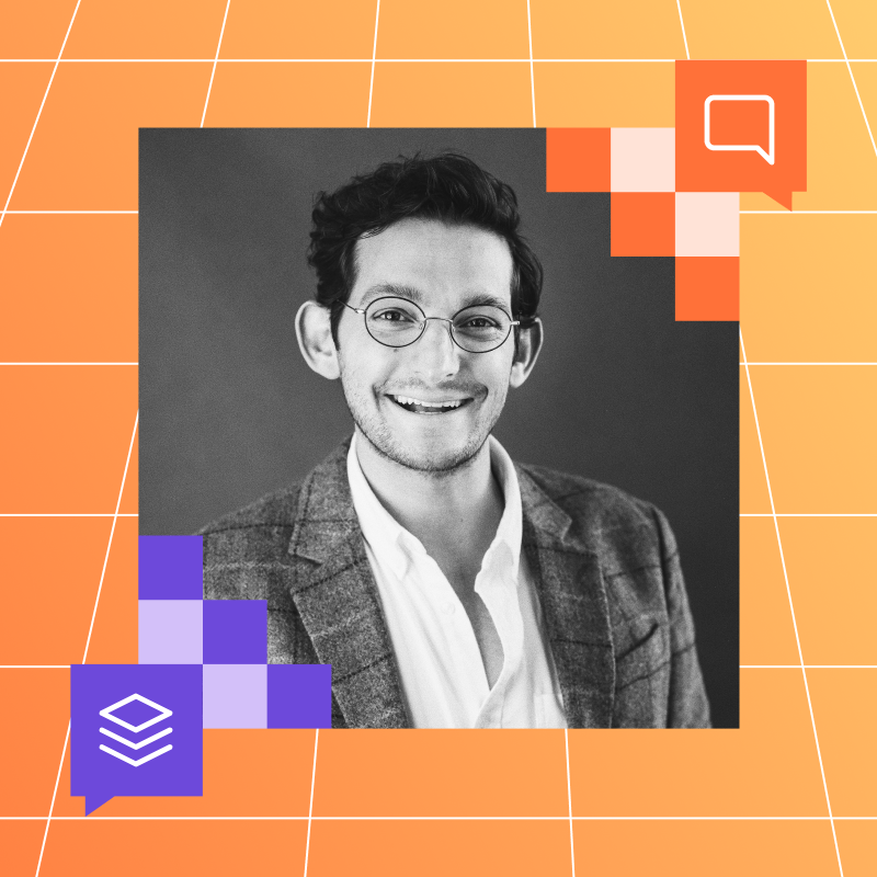 Matt Klein, Reddit’s head of global foresight, smiling while wearing glasses and a blazer. The background is a gradient of orange and purple squares with white grid lines.