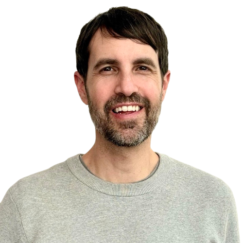 Headshot of Peter Rojas, Senior Vice President of New Products at Mozilla, wearing a gray sweater and smiling against a white background.