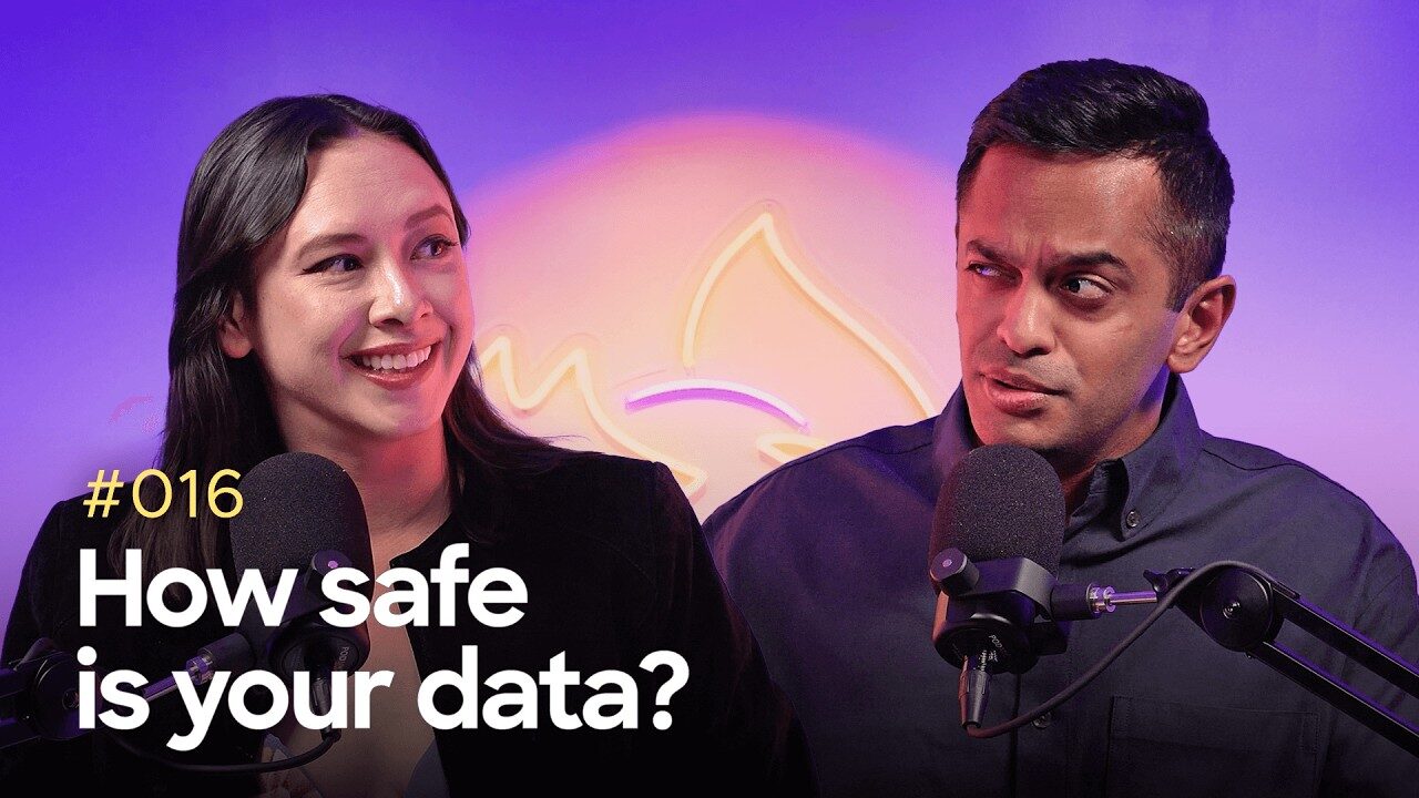 Two podcast hosts sit in front of microphones, discussing data privacy with a neon Firefox logo glowing behind them.