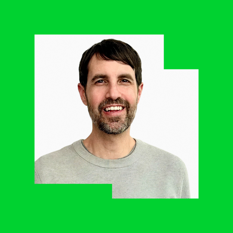 Headshot of Peter Rojas, Senior Vice President of New Products at Mozilla, wearing a gray sweater and smiling against a white background.